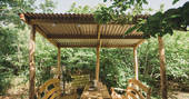 The hand-crafted outdoor eating area to shelter from rain or shine at the Sussex Roundhouse in Sussex