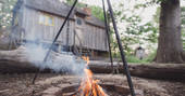 Snuggle up around the fire at Woodcutter's Cottage in Sussex