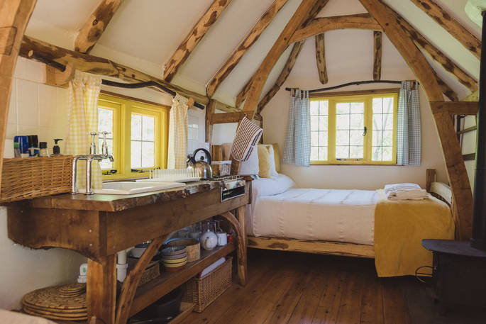 The adorable yellow themed interiors of Woodcutter's Cottage in Sussex