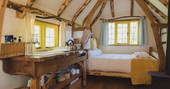 The adorable yellow themed interiors of Woodcutter's Cottage in Sussex