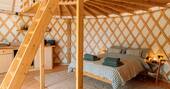 Bed under the mezzanine with dining area