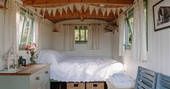 Jesters shepherds hut interior double bed, Priors Hardwick, Warwickshire