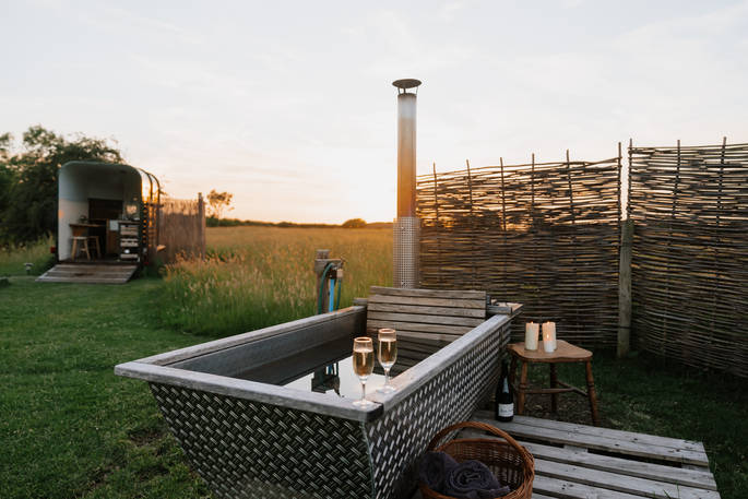 Slinket tipi hot tub on sunset, Priors Hardwick, Warwickshire