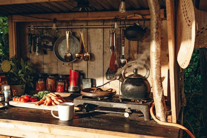 Kitchen equipped with a two ring gas hob and other utensils