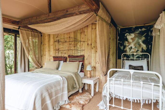 Sleeping tent with a double bed, single bed and a bunk bed
