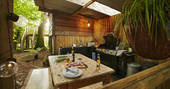 Oakdown Treehouse - outdoors covered dining area, Colerne, Wiltshire
