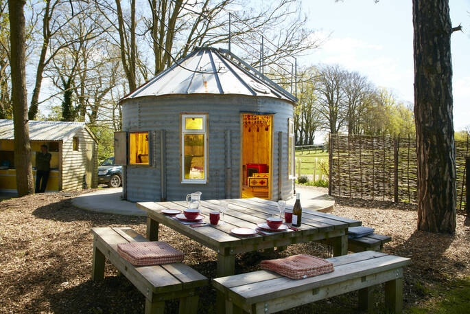outdoor table and outhouse