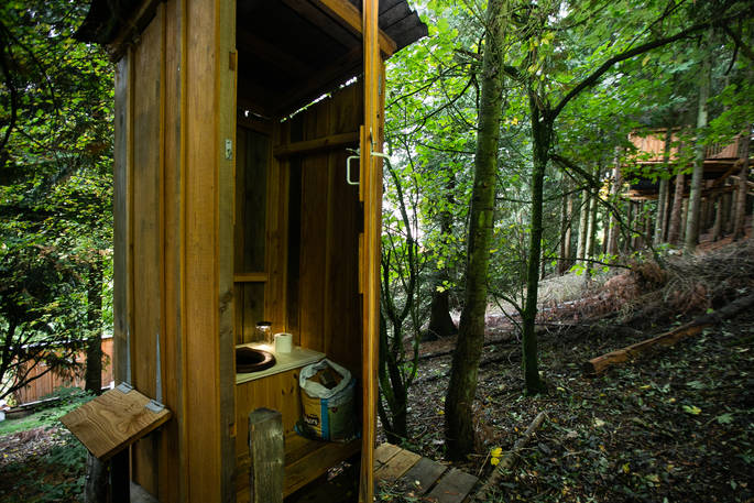 Interior of the compost loo at Puckshipton Tree house in Wiltshire 