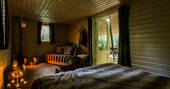 View of the cosy living area from the kingsize bed at Jollydays in Yorkshire