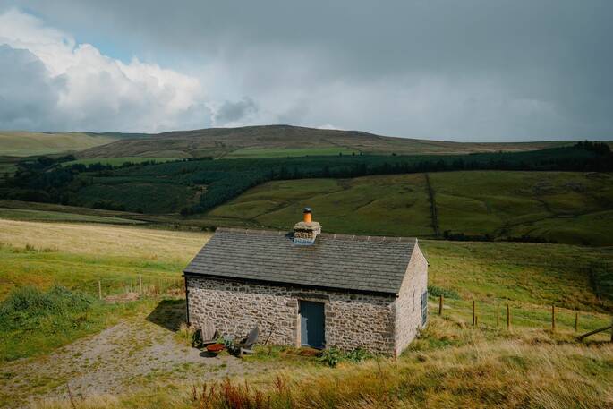 Bothy in field