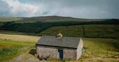Bothy in field