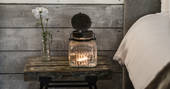 Cosy furnishings and candles inside Whitby cabin at North Star Club in Yorkshire