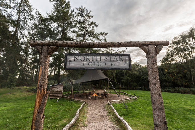 North Star Club sign leading on to the covered fire pit area