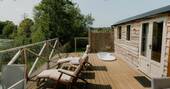 Decking with sunken bath tub and recliners