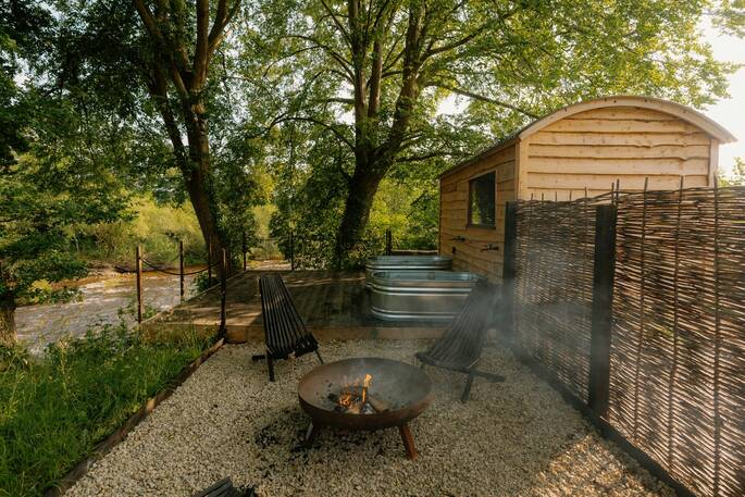 Sauna hut, cold plunge baths and fire pit