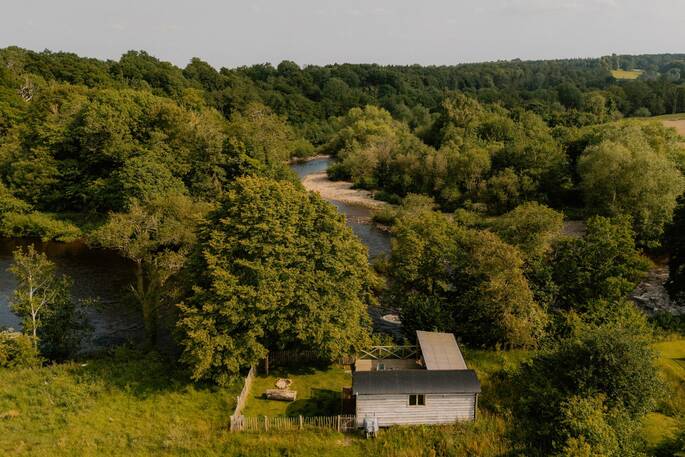 Shepherds hut and river from above