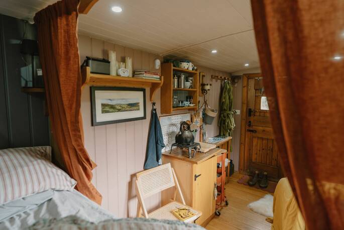 Behind the bed curtains