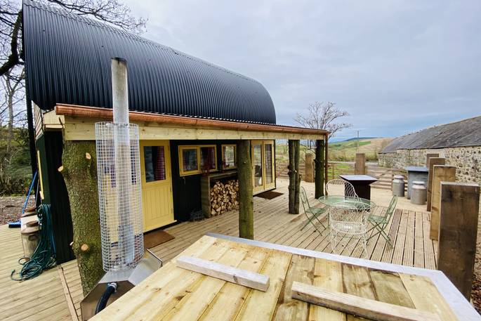 The Dairy at Denend exterior and square hot tub, Boutique Farm Bothies at Huntly, Aberdeenshire