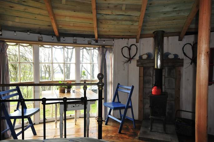 Dining area and wood burner at Kittiwake, Argyll and Bute