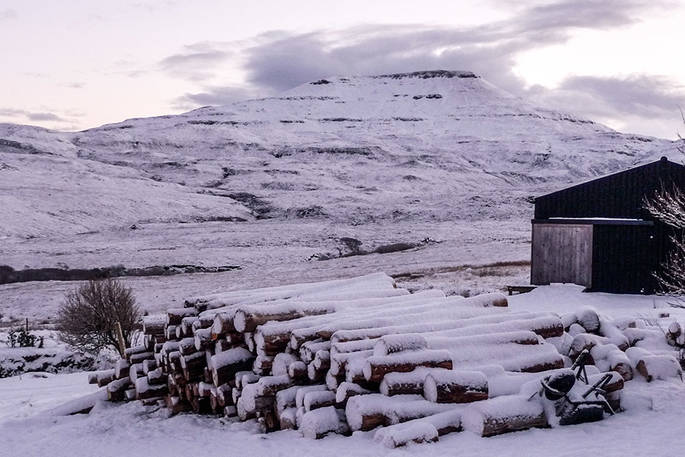 Black Shed cabin under snow
