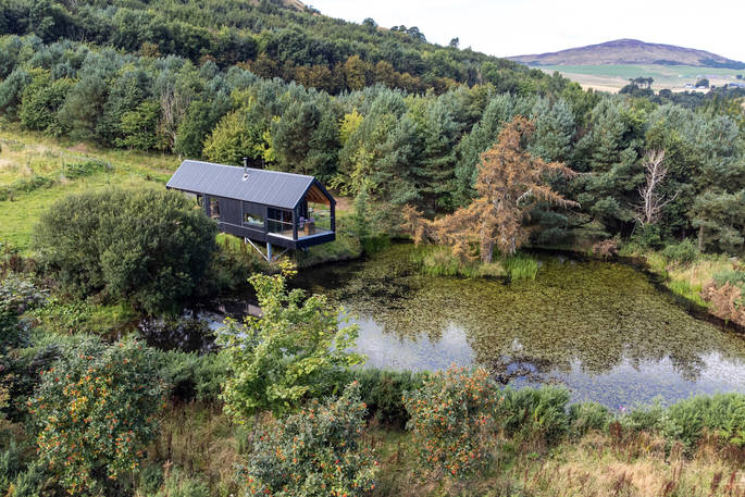 Bothan Dubh cabin at the pond, drone view, Perthshire, Perth & Kinross, Scotland