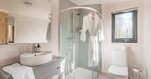 Modern bathroom with flushing toilet and shower