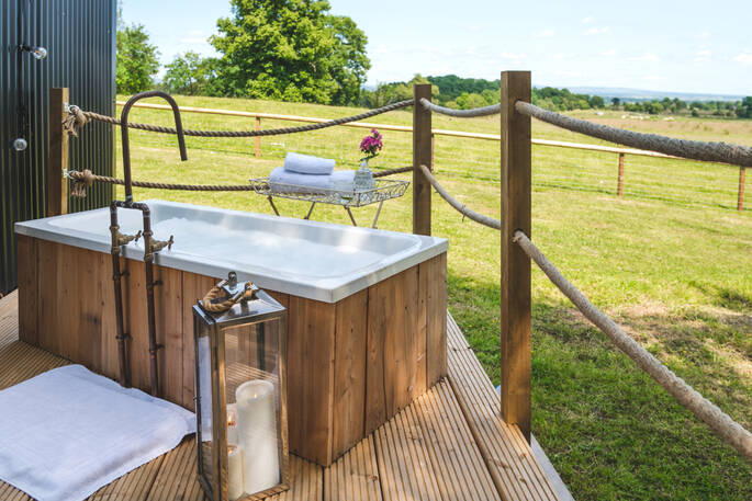 Outdoor bath tub on the decking