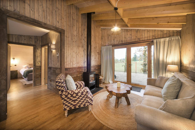 Flycatcher Treehouse living room with wood burner at Doune, Stirling, Scotland