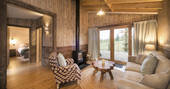 Flycatcher Treehouse living room with wood burner at Doune, Stirling, Scotland
