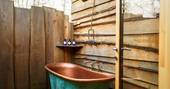 Willow Warbler Treehouse outdoor bath tub at Doune, Stirling, Scotland