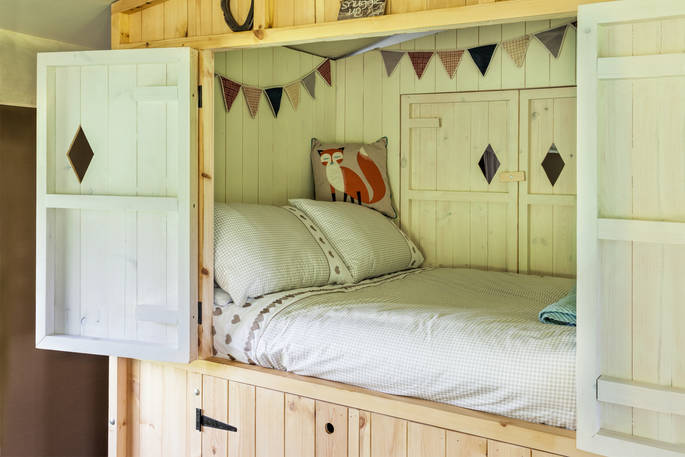 Bed interior at Castan Lodge, Anglesey