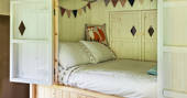 Bed interior at Castan Lodge, Anglesey