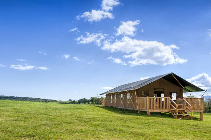The exterior of Onnen Lodge in the sunshine in Anglesey, Wales