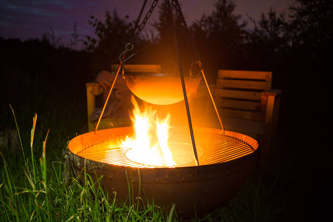 Toast marshmallows or cook a feast on the cosy firepit at Gwdihw shepherd's hut, Ty Cerrig