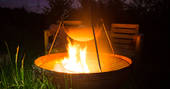 Toast marshmallows or cook a feast on the cosy firepit at Gwdihw shepherd's hut, Ty Cerrig