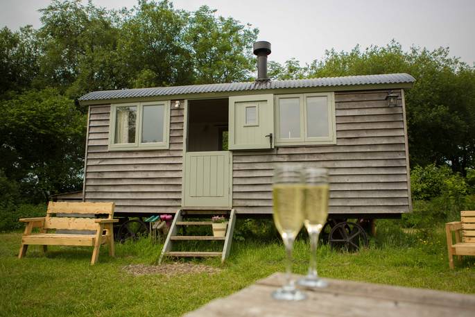 Outside the beautiful and charming Gwdihw shepherd's hut at Ty Cerrig near Cardiff