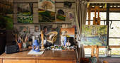 Artwork and painting paraphernalia at the Log House Studio, Cwm Farm, Carmarthenshire