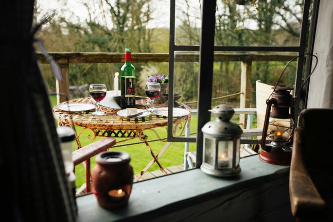 Looking out onto the verandah at the Log House Studio, Carmarthenshire