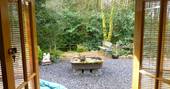 Outdoor decking and garden at Waterfall Pagoda Yurt, Carmarthenshire