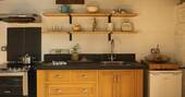 6 - kitchen equipped with an oven, stove and undercounter fridge