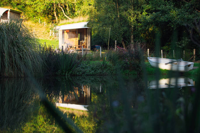 Derwen Cabin lake and boat, One Cat Farm, Lampeter, Ceredigion, Wales
