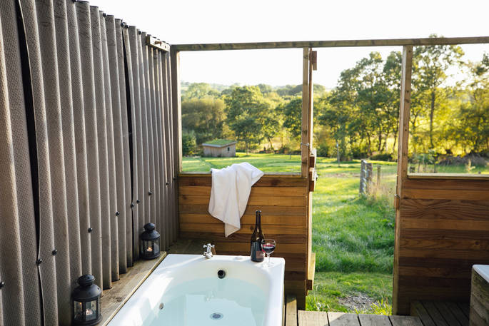The outdoor bath at One Cat Farm in Ceredigion, Wales