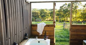 The outdoor bath at One Cat Farm in Ceredigion, Wales