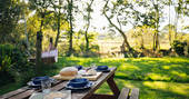 The Den cabin - outdoor picnic table, One Cat Farm, Lampeter, Ceredigion, Wales
