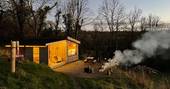 The Lookout cabin during dusk with fire pit, One Cat Farm, Lampeter, Ceredigion, Wales