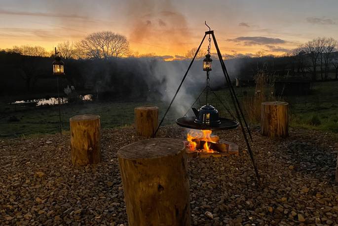 The Lookout cabin fire pit and kettle during sunset, One Cat Farm, Lampeter, Ceredigion, Wales