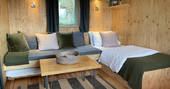 The Lookout cabin - interior sofa converted in a single bed, One Cat Farm, Ceredigion, Wales