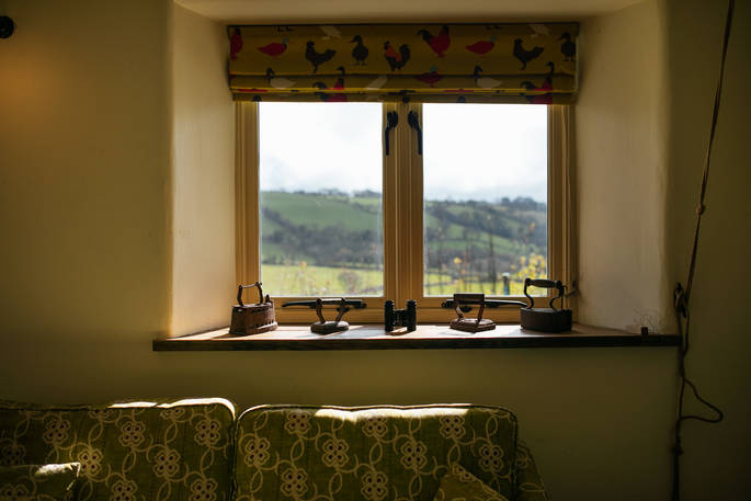 A view of the sunny hills from the window at Locke's Cottage in Wales