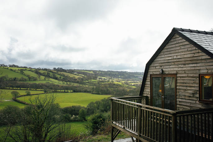 The balcony with a view over the rolling hills at Locke's Cottage in Wales.