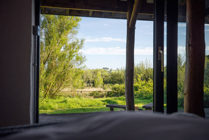 The Stoep cabin view from the bed at Wildernest, Lampeter, Ceredigion, Wales